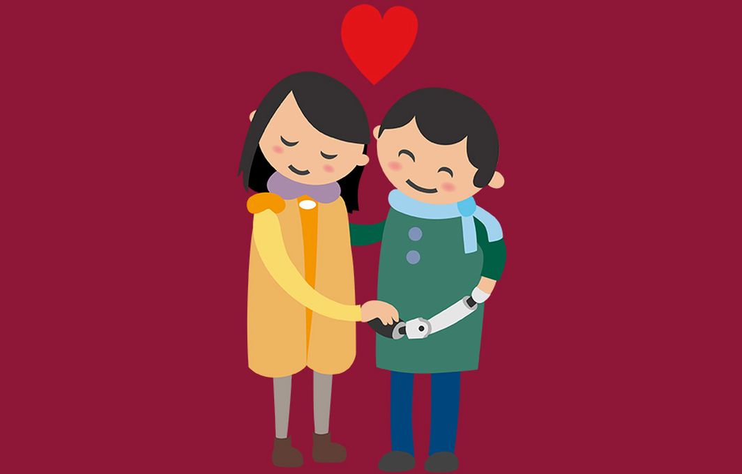 Das Bild zeigt zwei Inklumojis, zwischen denen ein Herz steht. Sie haben einen Arm umeinander gelegt und geben sich mit dem anderen die Hand. Ein Inklumoji trägt eine Armprothese.