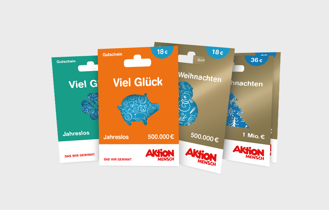Abbildung von Los-Gutscheinen in verschiedenen Gewinnkategorien und mit unterschiedlichen Motiven: einem Glücks-Schwein, einem Kleeblatt, einem Schneemann und einem Tannenbaum.