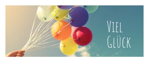 Bunte Luftballons mit Schriftzug: Viel Glück